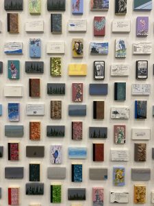 Wall of small paintings at the Halifax Public Library